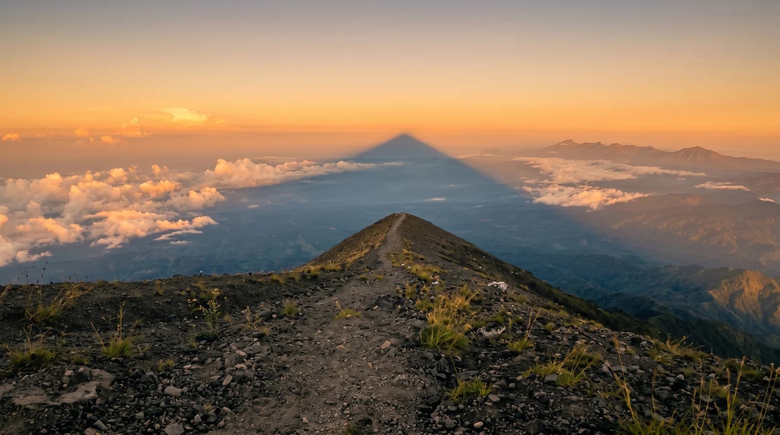 Stunning view of Mount Agung's shadow over lush landscapes during a Bali guided tour.