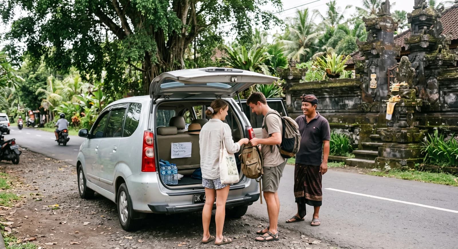 A Bali day with driver: minivan, luggage, water bottles, and route notes.