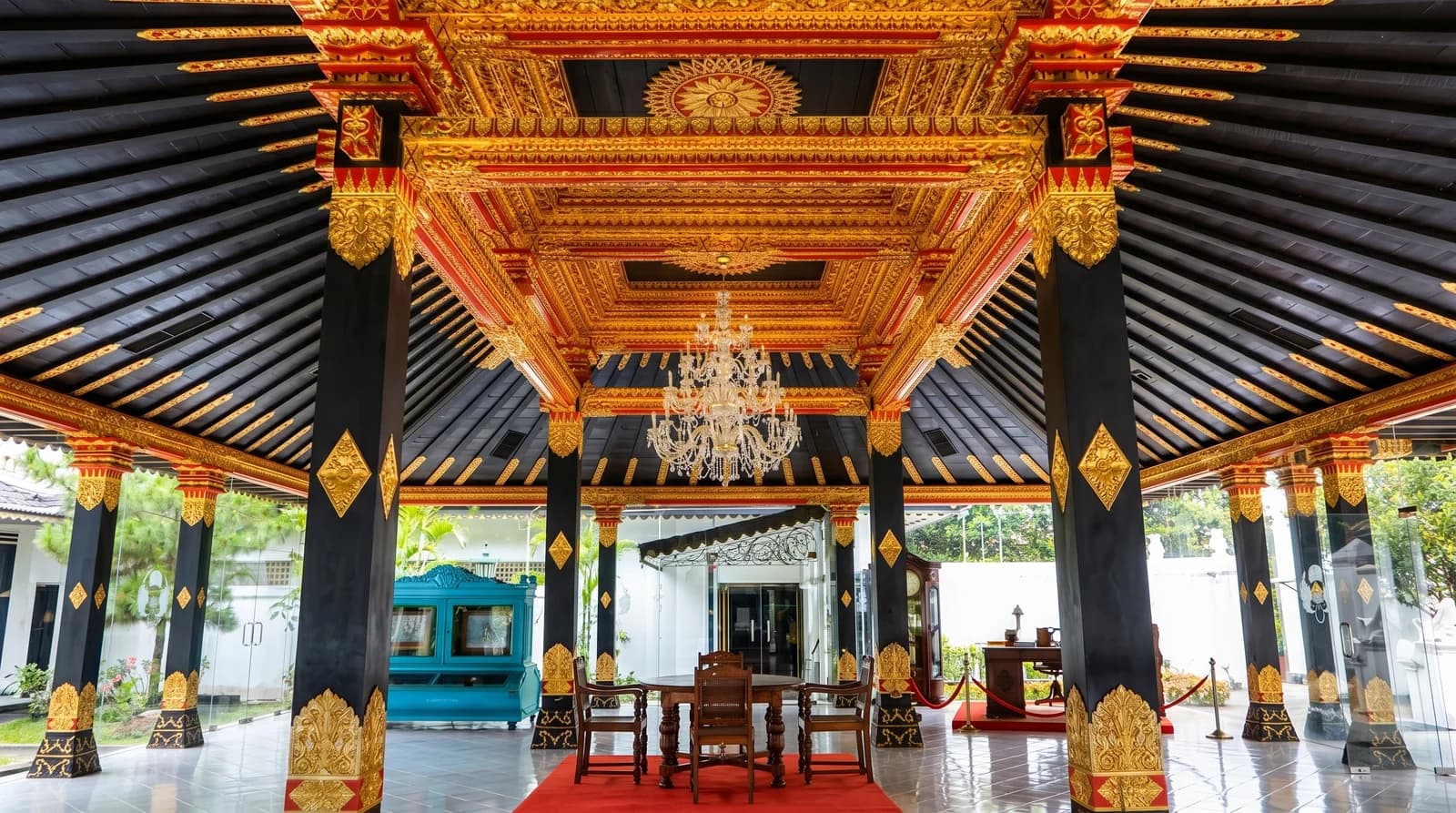 Interior scene of Kraton Yogyakarta showcasing ornate decor, reflecting the elegance of Indonesian heritage.
