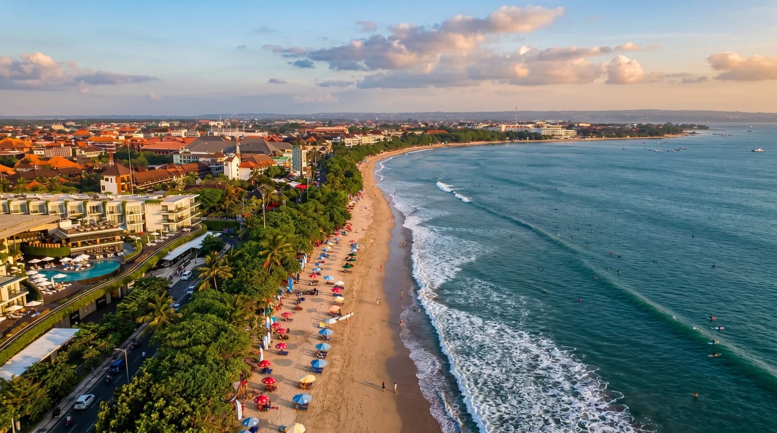Aerial view of Kuta Beach showcasing golden sands, waves, and vibrant scenery perfect for Bali tours.