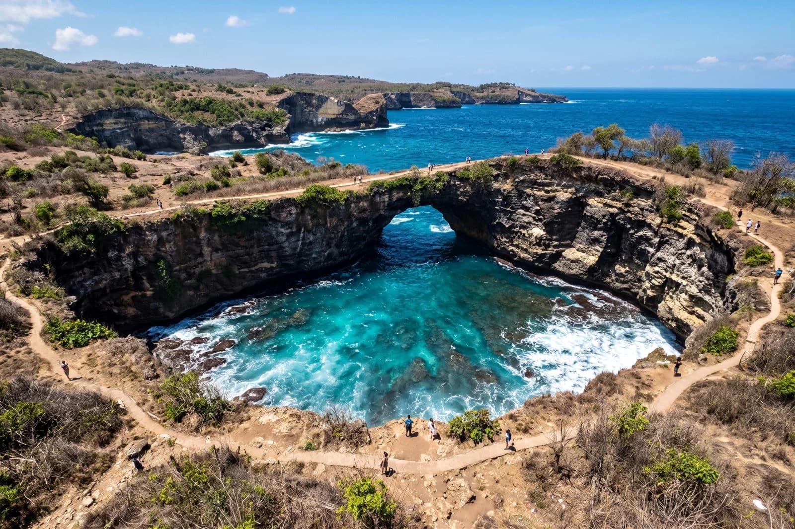The circular Broken Beach cove on Nusa Penida with a natural stone arch.