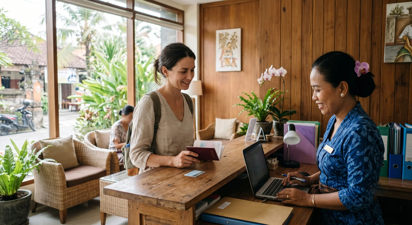 A foreign tourist checking in at a private clinic reception in Bali