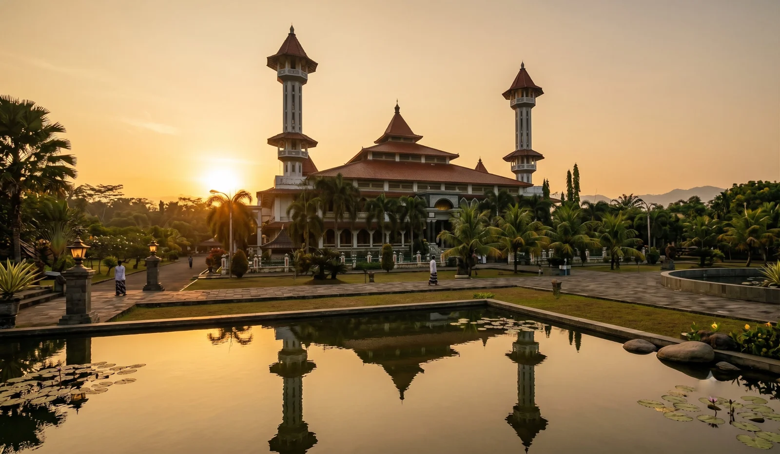 A traditional Javanese mosque with a tiered roof in evening light